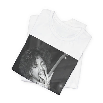 A black graphic t-shirt featuring a graphic or photo of Prince performing wildly on stage.