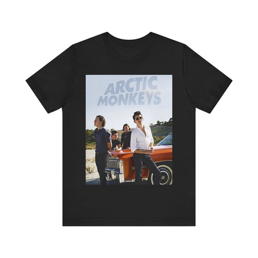 A black graphic t-shirt featuring a design related to Arctic Monkeys' 'AM' album era, possibly with the album art or band imagery.