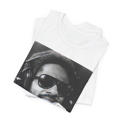 A black graphic t-shirt featuring a graphic of Stevie Wonder as a timeless visionary.