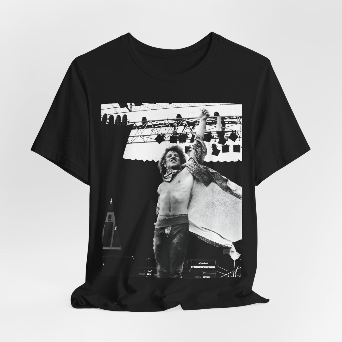 A black graphic t-shirt featuring an epic arena rock graphic of Bon Jovi performing on a large stage.