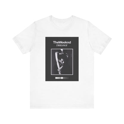 A black graphic t-shirt featuring a graphic related to The Weeknd's 'Trilogy' album.