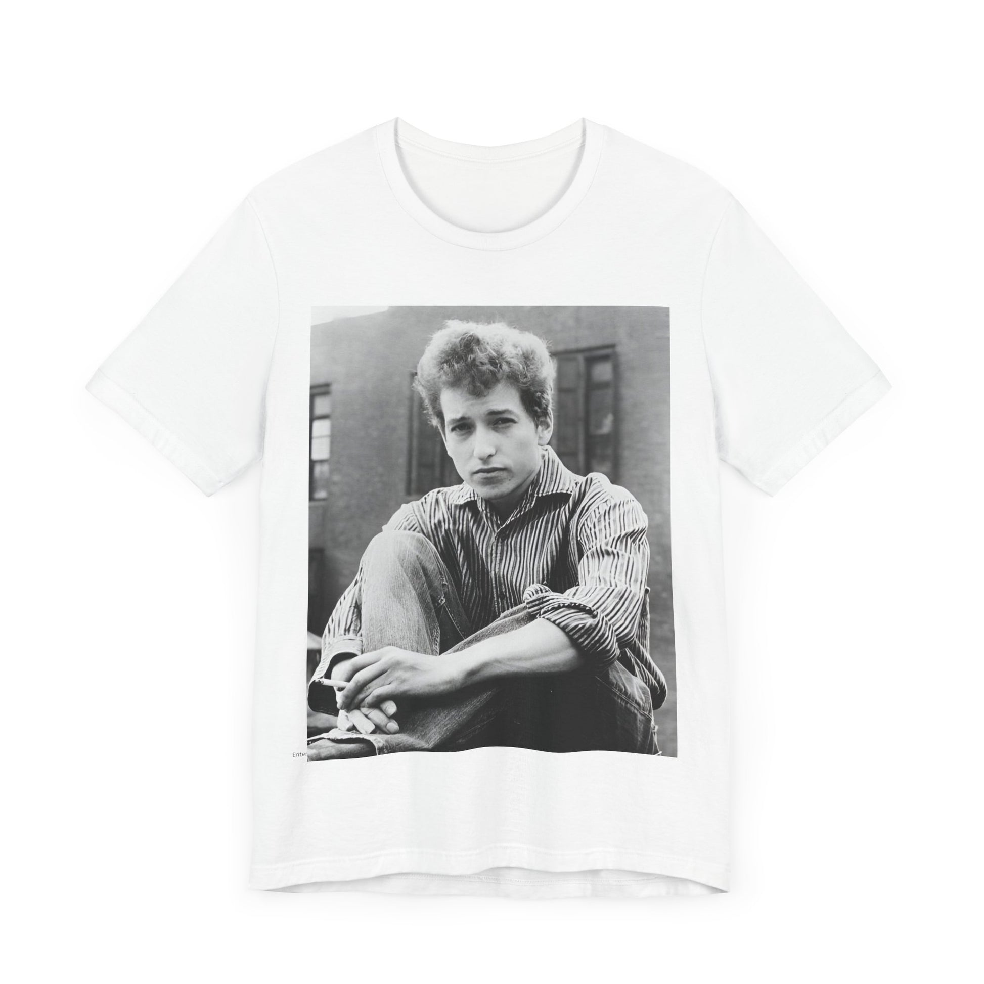 A black graphic t-shirt featuring a graphic of Bob Dylan from his 60s origins in folk music.