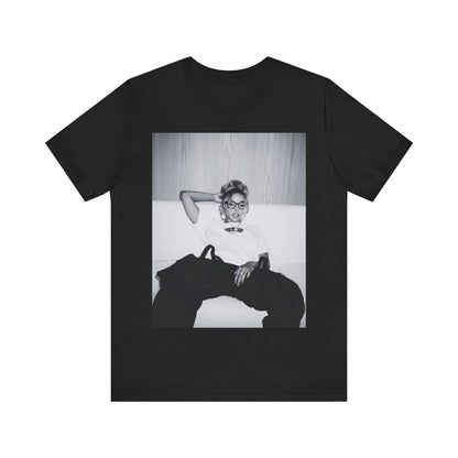 A black graphic t-shirt featuring a black and white portrait photo of Tinashe.