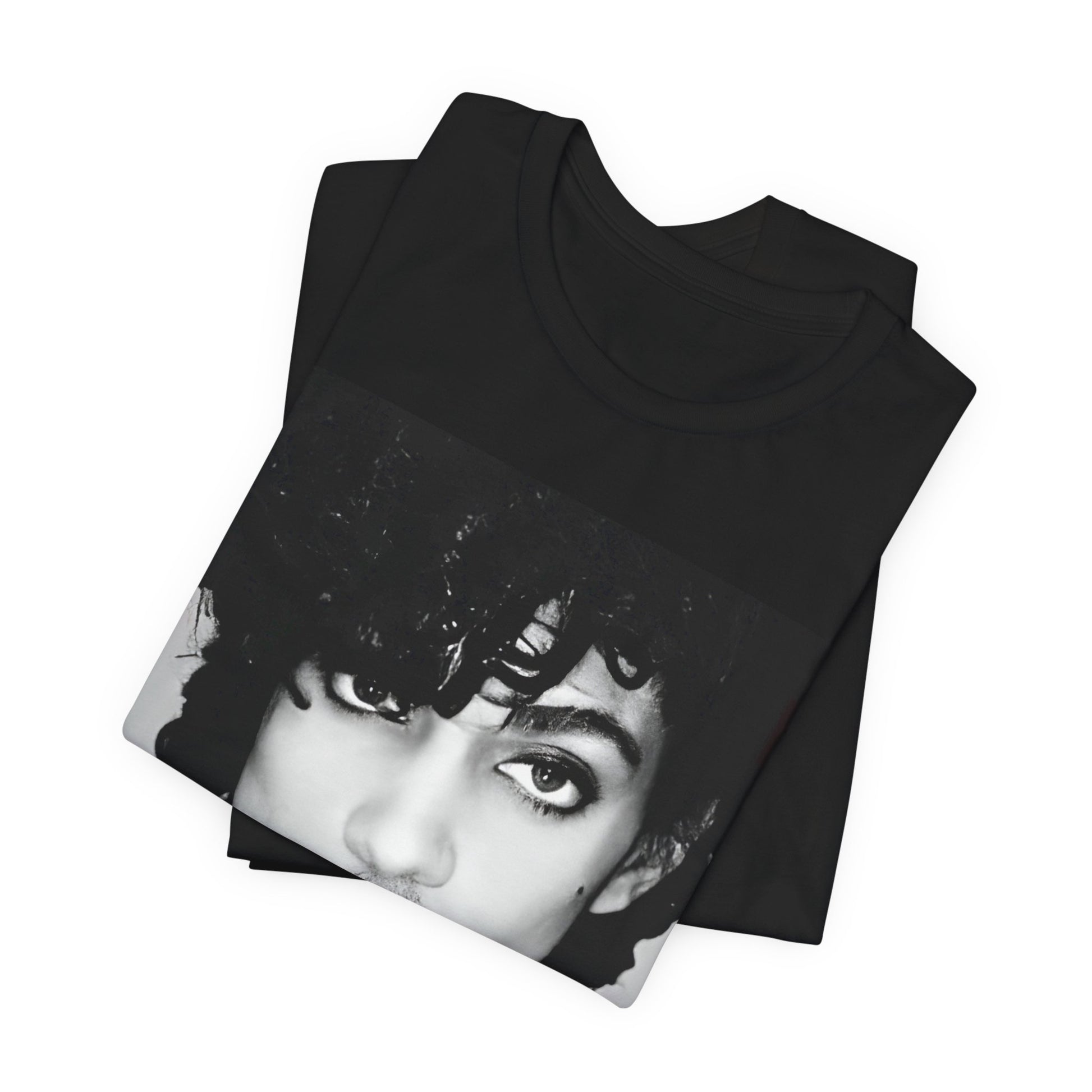A black graphic t-shirt featuring a black and white photo portrait of Prince.