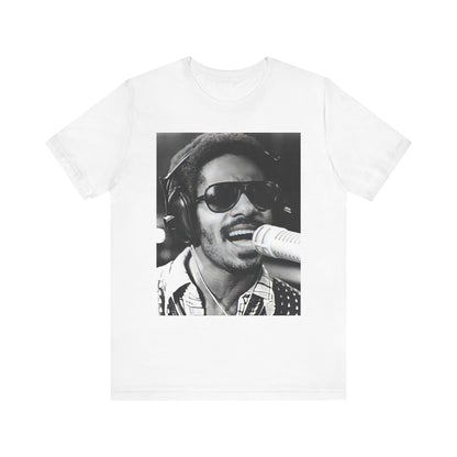 A black graphic t-shirt featuring a graphic of Stevie Wonder as a timeless visionary.
