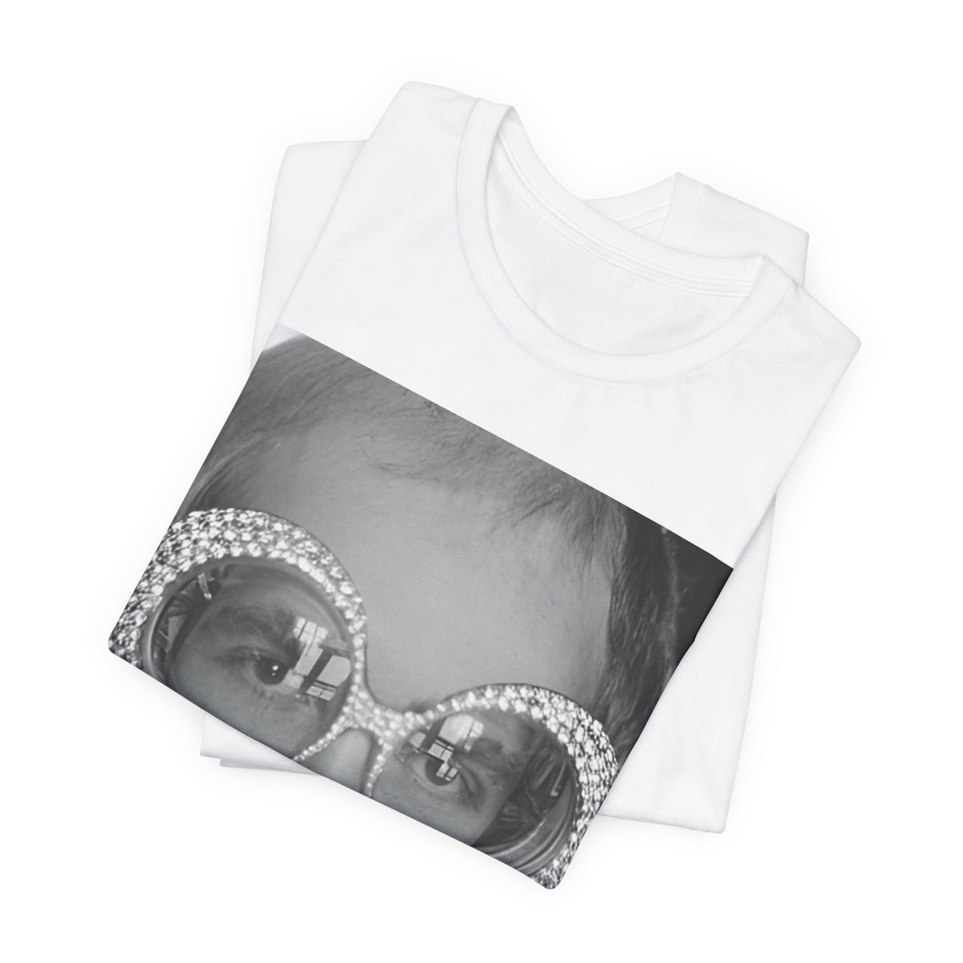 A black graphic t-shirt featuring a graphic of Elton John emphasizing his iconic glasses and fashion.