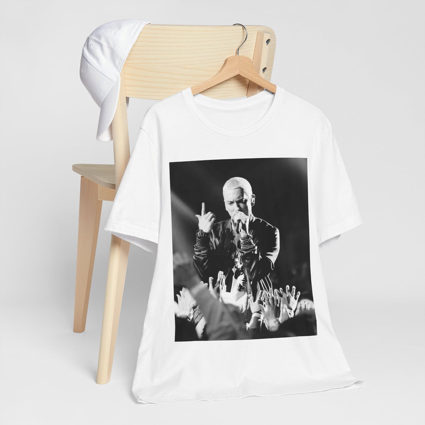 A black graphic t-shirt featuring a graphic or photo of Eminem performing live on stage.