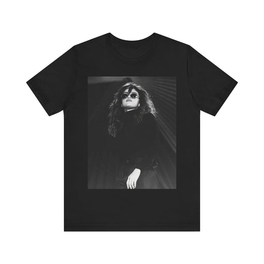 A black graphic t-shirt featuring a black and white, monochrome graphic or photo of Selena Gomez.