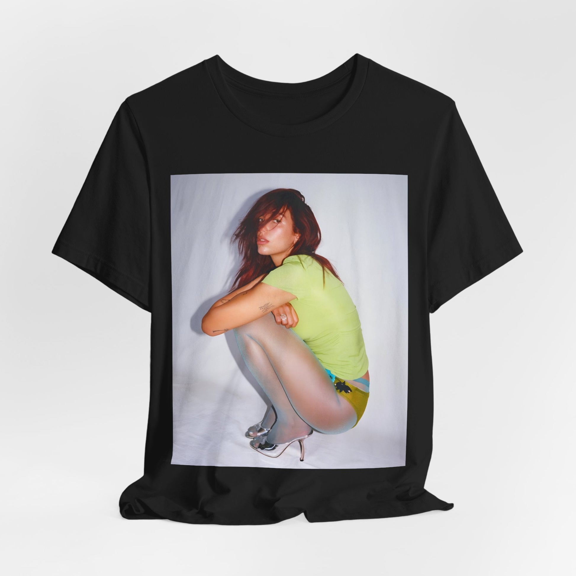 A black graphic t-shirt featuring a graphic inspired by Dua Lipa's 'Houdini' song.