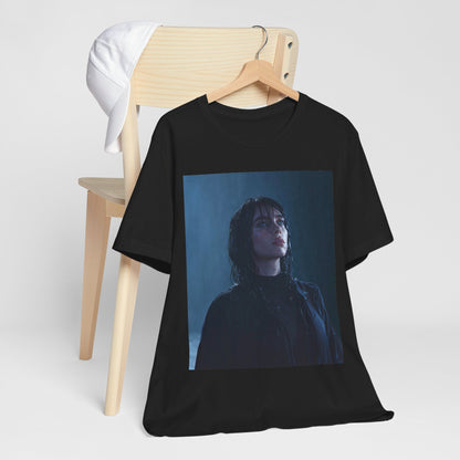 A direct, powerful portrait of Billie Eilish, embodying the 'HIT ME HARD AND SOFT' album era, printed on a graphic t-shirt.