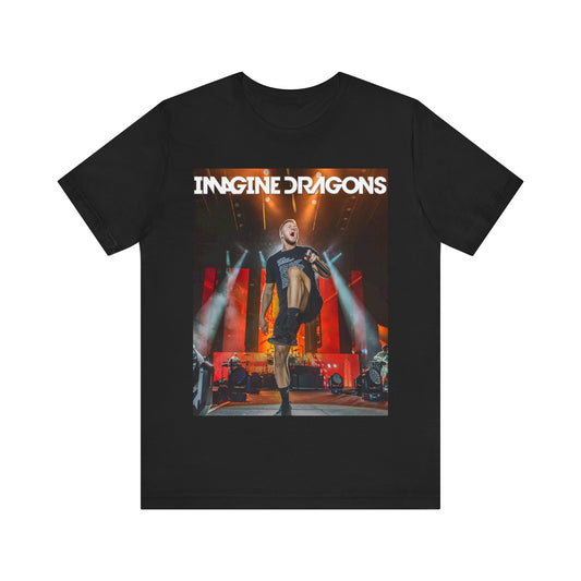 A black graphic t-shirt featuring a graphic or photo of Imagine Dragons performing live on stage.