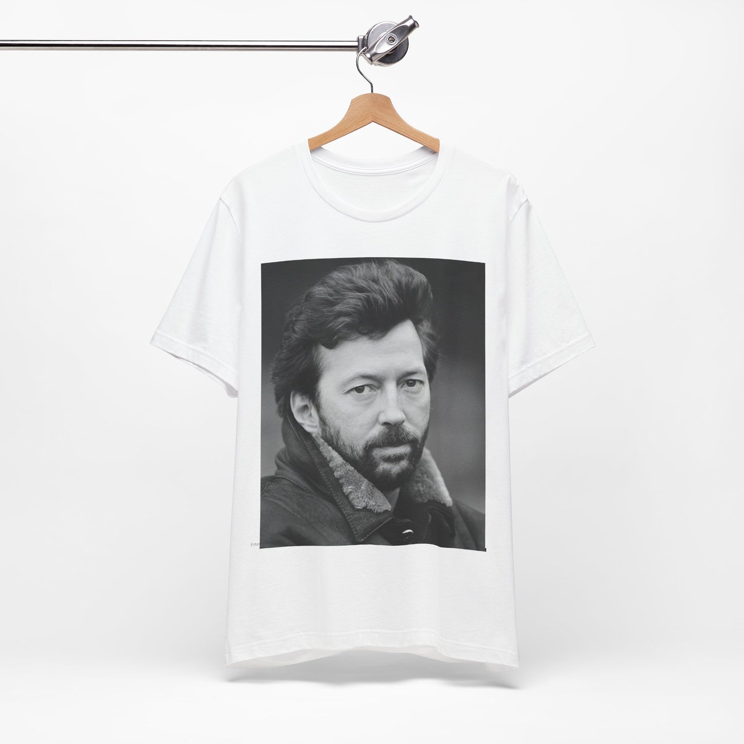A black graphic t-shirt featuring a 70s rock aesthetic graphic of Eric Clapton.