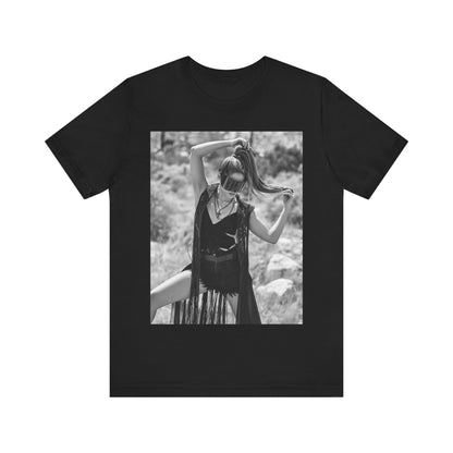 A black graphic t-shirt featuring a black and white, monochrome graphic or photo of Shakira.