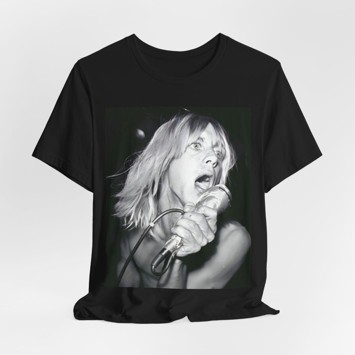 A black graphic t-shirt featuring a graphic of Iggy Pop as the Godfather of Punk, performing live.