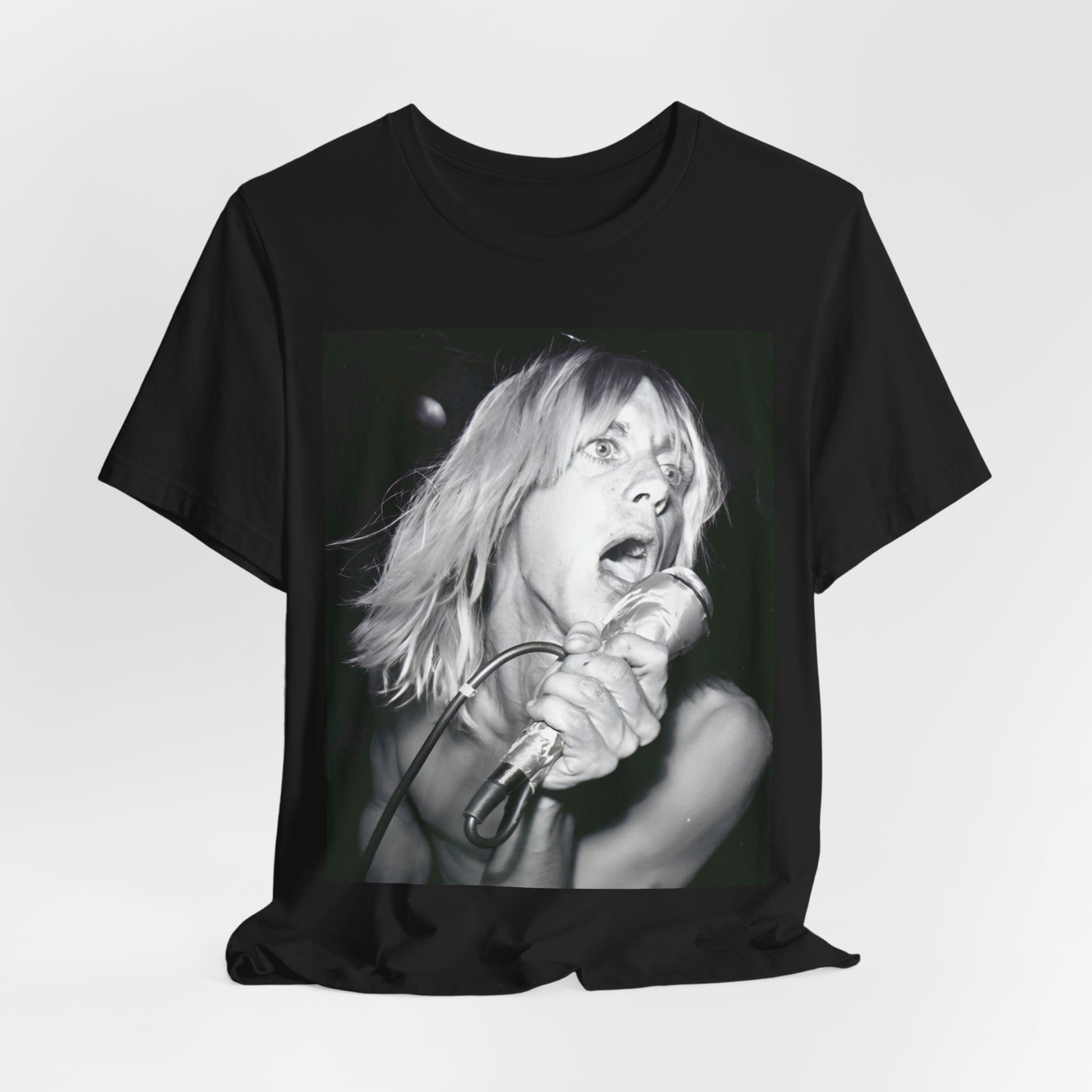A black graphic t-shirt featuring a graphic of Iggy Pop as the Godfather of Punk, performing live.