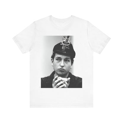 A black graphic t-shirt featuring a graphic of Bob Dylan in an acoustic session setting, possibly with his guitar.