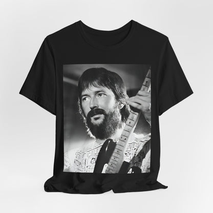 A black graphic t-shirt featuring a graphic of Eric Clapton as an authentic guitar god.