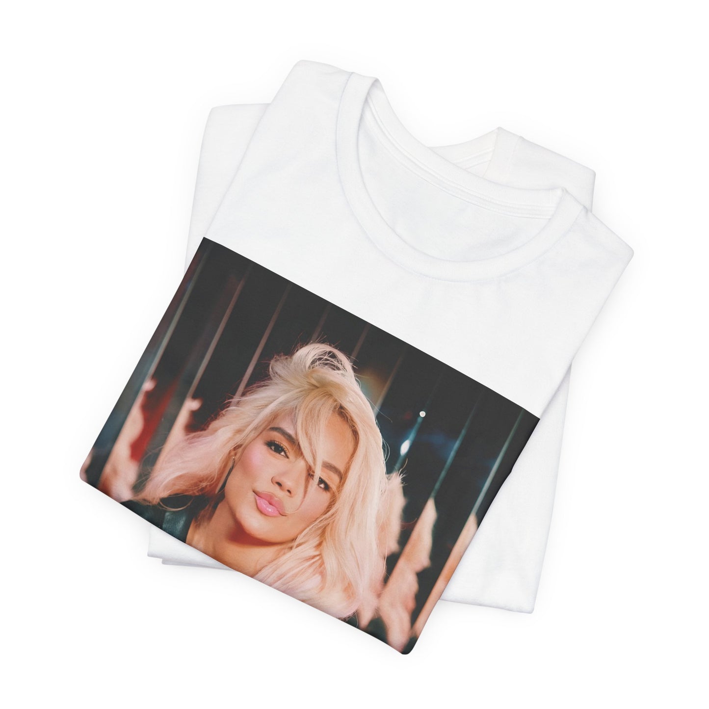 A black graphic t-shirt featuring a graphic of Karol G as an empowered Latina icon.