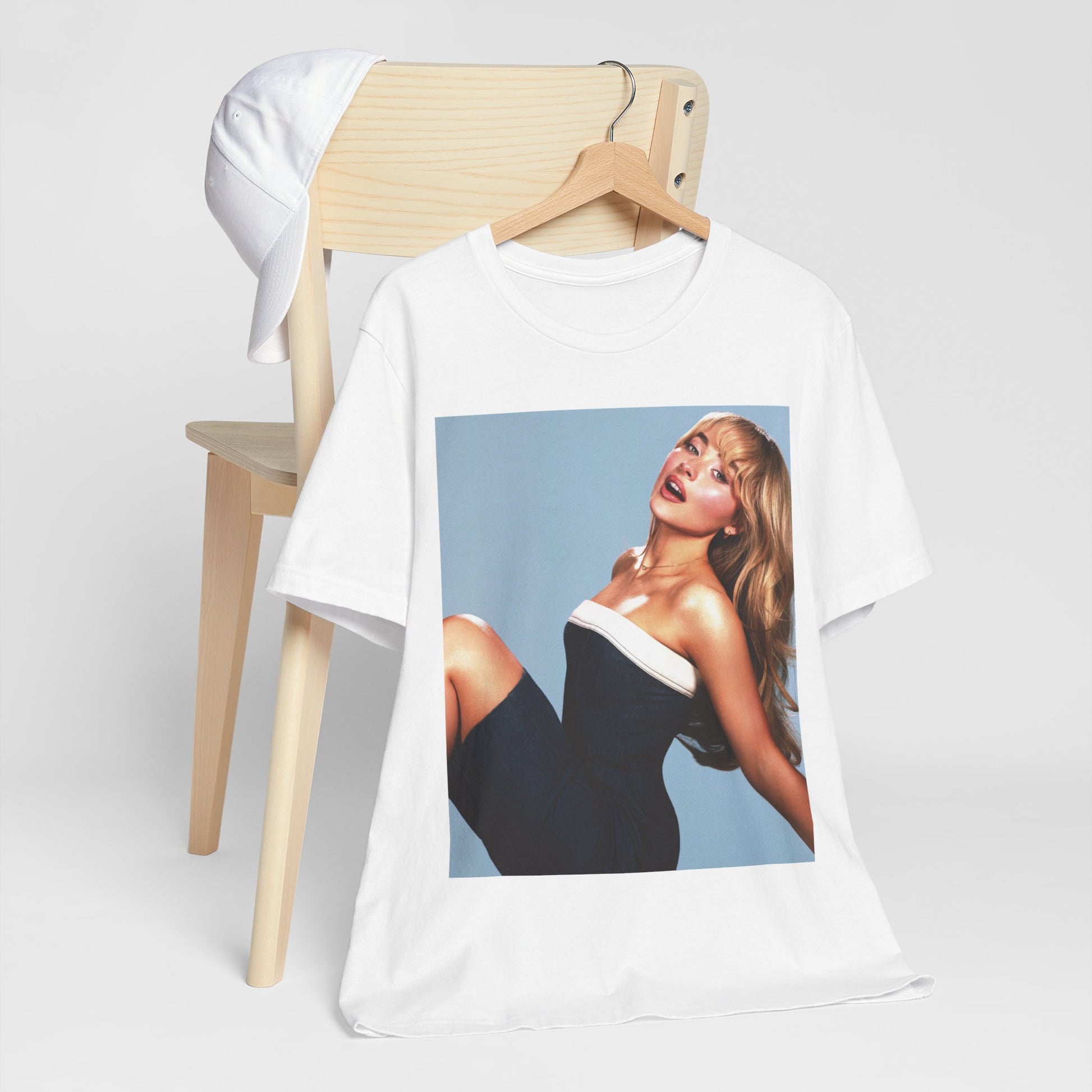 A black graphic t-shirt featuring a graphic related to Sabrina Carpenter's 'Espresso' song or era.