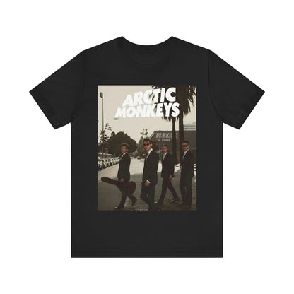 A black graphic t-shirt featuring Arctic Monkeys in a pose or setting similar to the iconic 'Abbey Road' album cover.