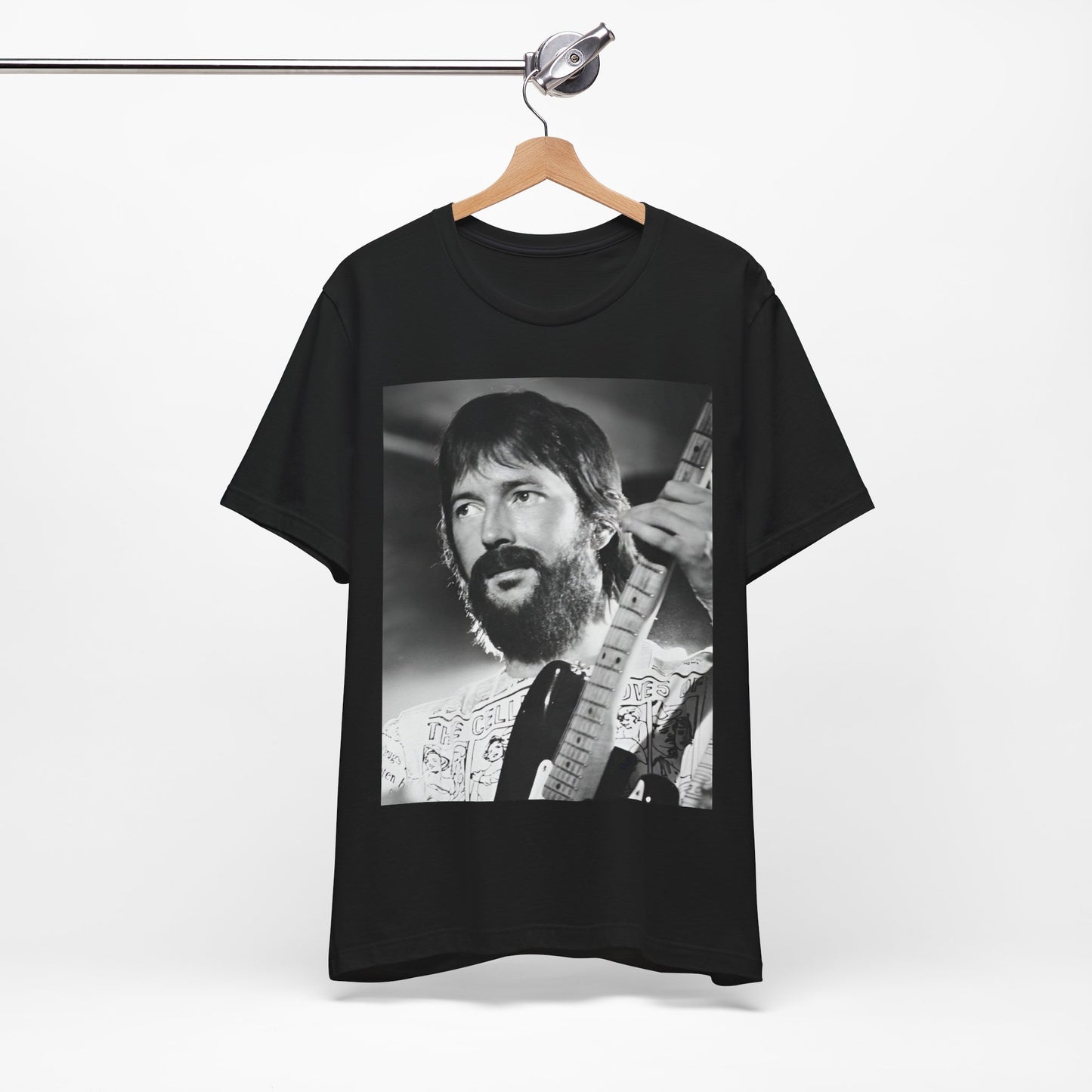 A black graphic t-shirt featuring a graphic of Eric Clapton as an authentic guitar god.