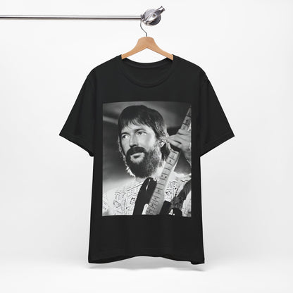 A black graphic t-shirt featuring a graphic of Eric Clapton as an authentic guitar god.