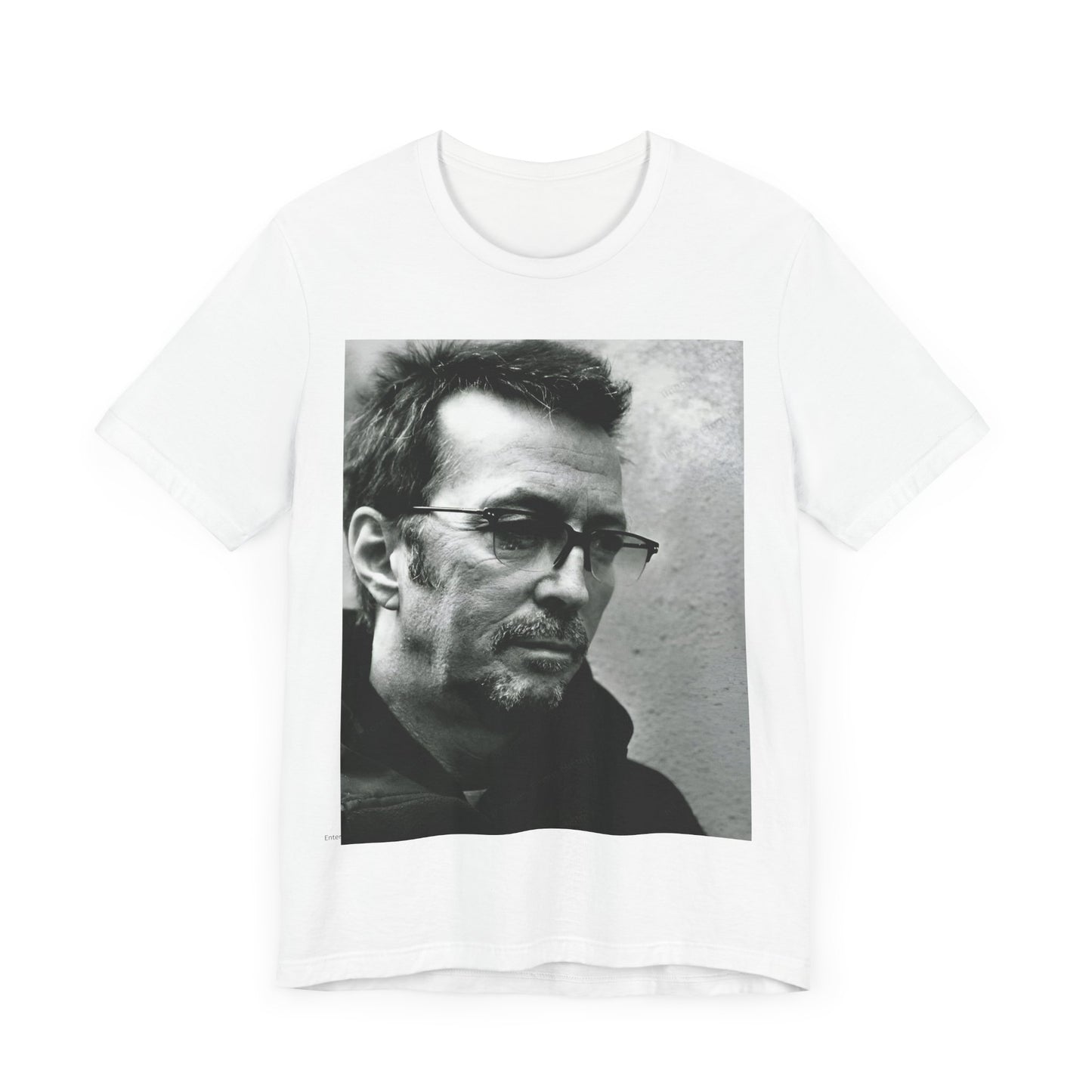 A black graphic t-shirt featuring a black and white, monochrome graphic or photo of Eric Clapton.