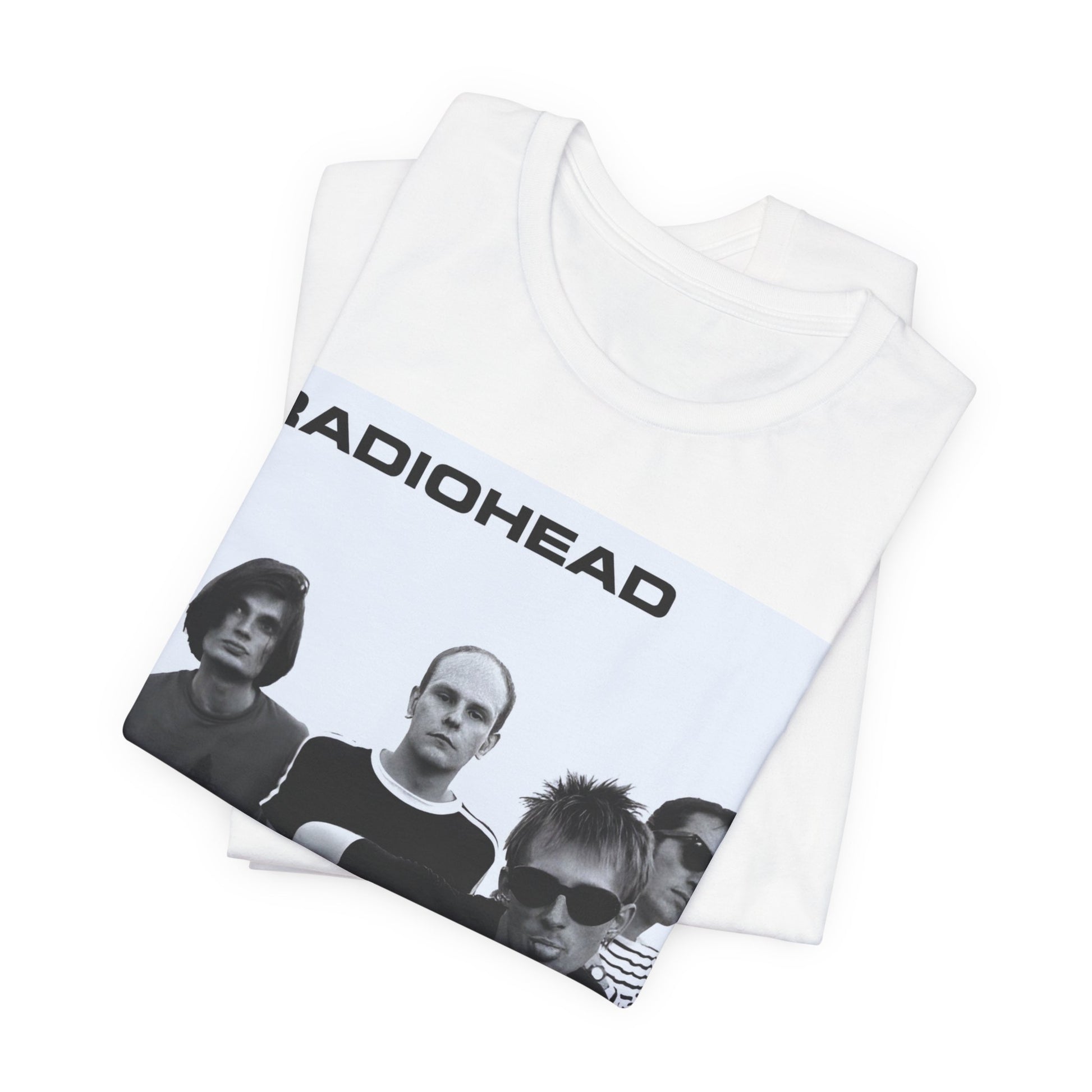 A black graphic t-shirt featuring a vintage 90s graphic related to Radiohead's 'Creep' song or era.