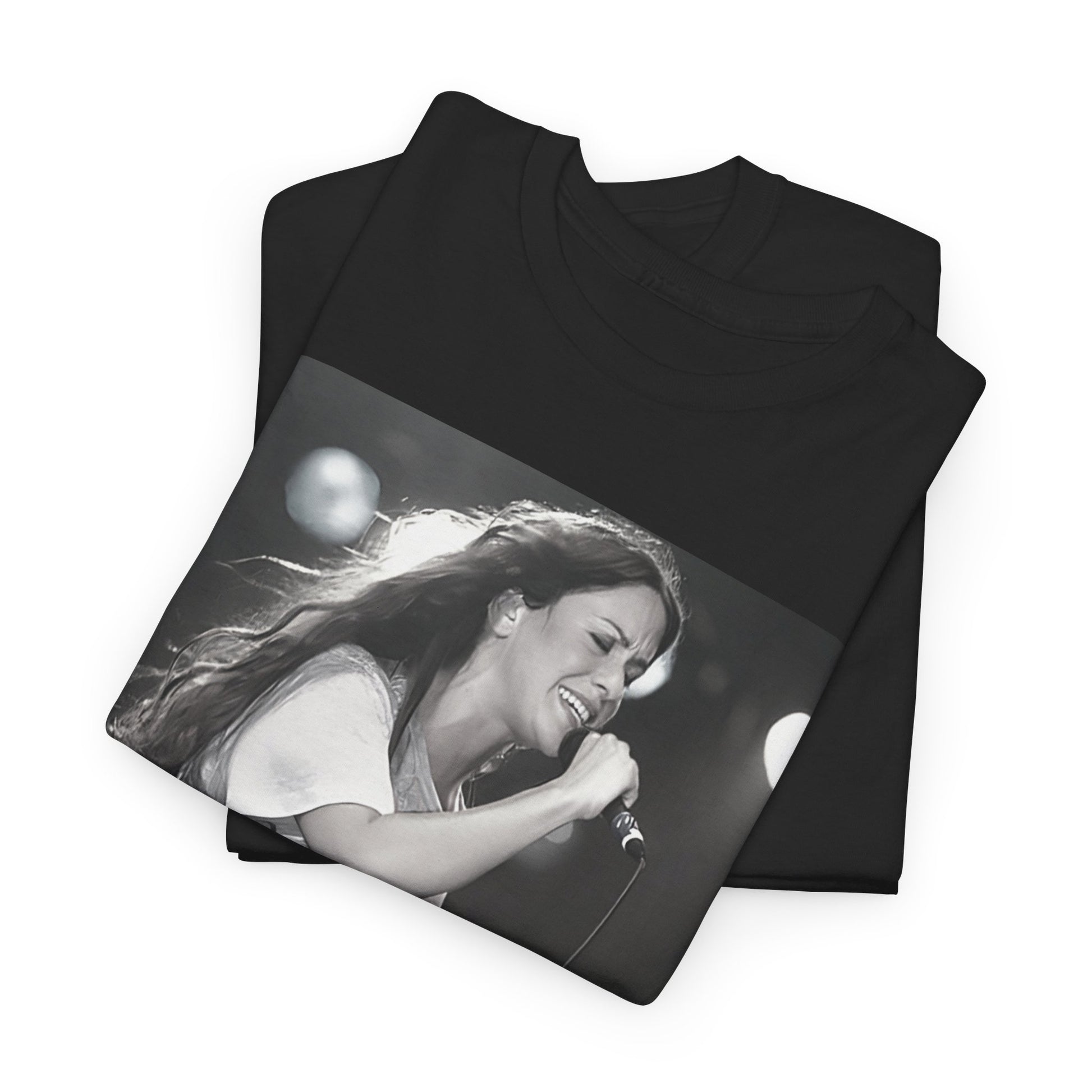 A black graphic t-shirt featuring a photo of Alanis Morissette performing live on stage in the 1990s, with a dynamic expression.