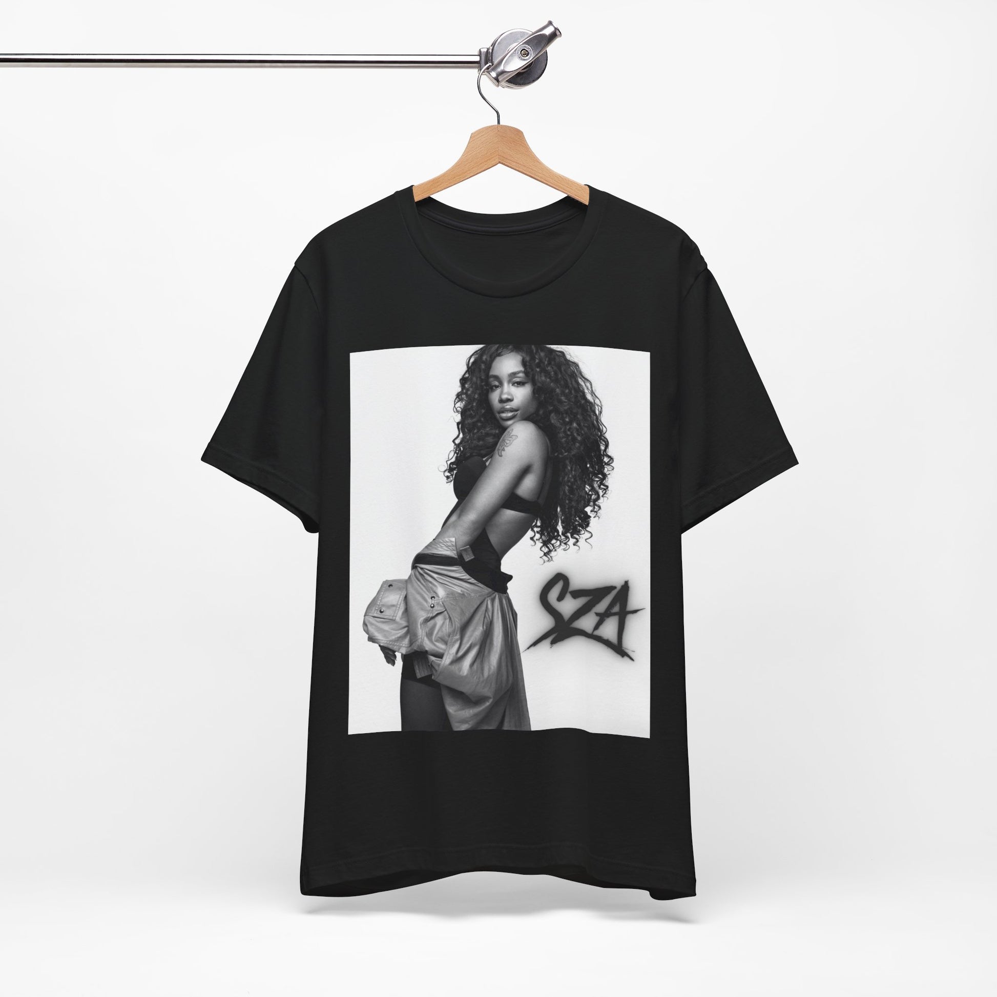 A black graphic t-shirt featuring a black and white portrait photo of SZA.