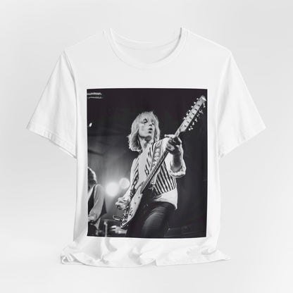 A black graphic t-shirt featuring a graphic of Tom Petty as a Rock & Roll Hall of Fame icon.