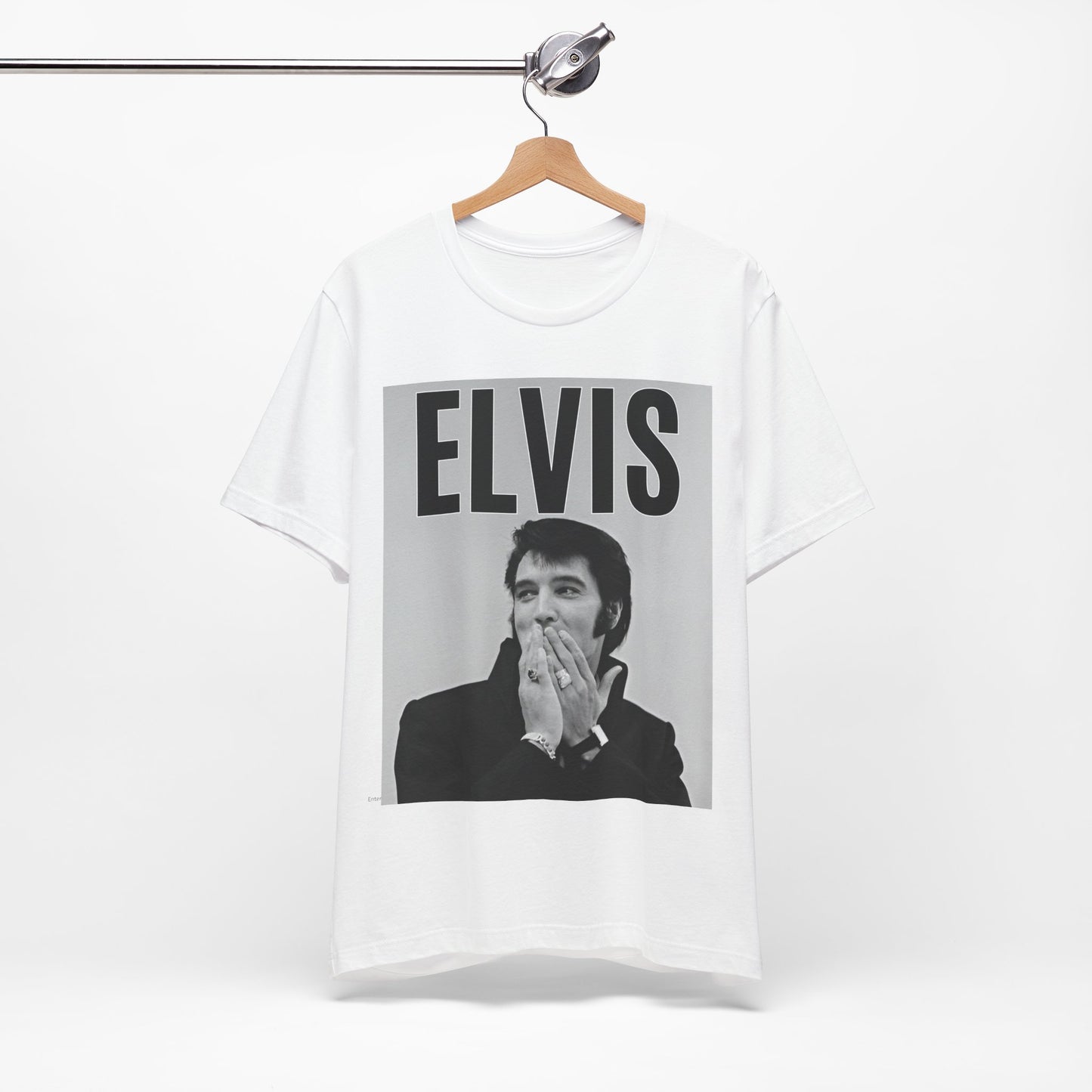 A black graphic t-shirt featuring a retro graphic of Elvis Presley as a 'Rebel With A Cause.'