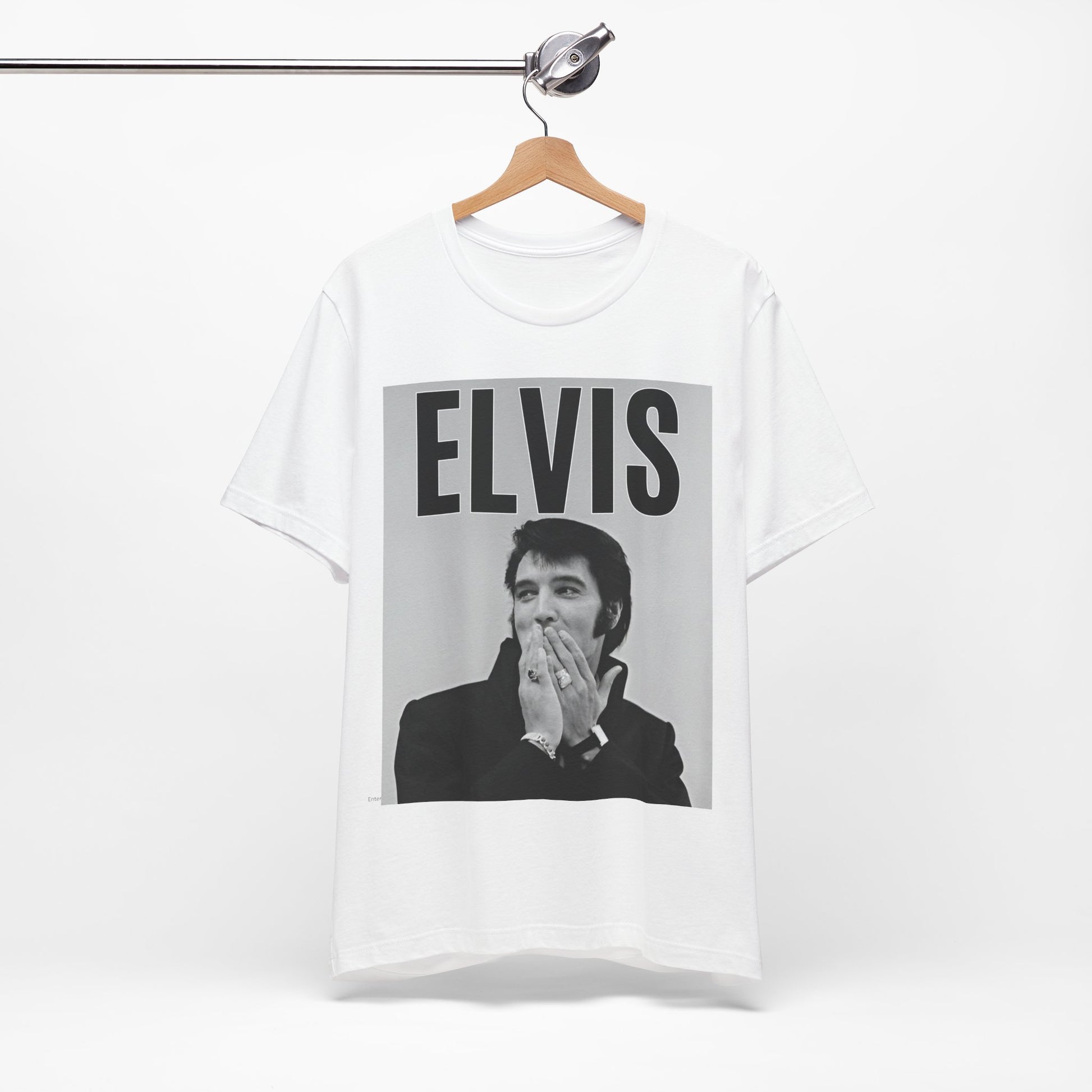 A black graphic t-shirt featuring a retro graphic of Elvis Presley as a 'Rebel With A Cause.'
