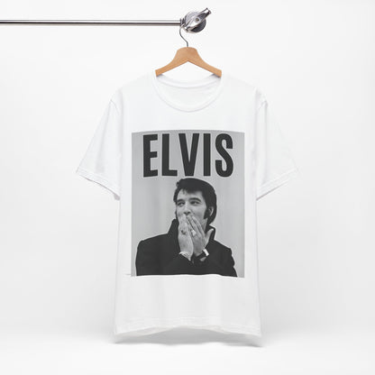 A black graphic t-shirt featuring a retro graphic of Elvis Presley as a 'Rebel With A Cause.'