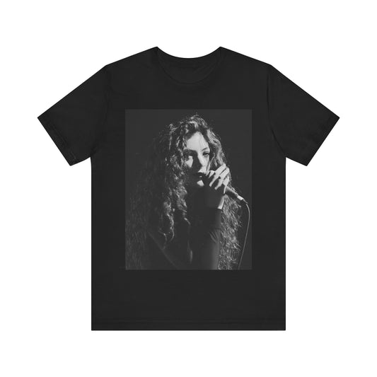 A black graphic t-shirt featuring a graphic or photo of Lorde performing live.