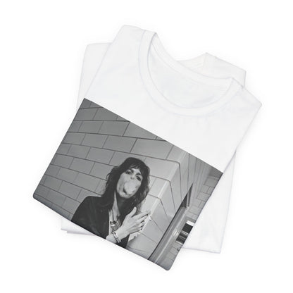 A black graphic t-shirt featuring a retro 70s photo of Aerosmith band members in a backstage setting, showing a candid moment.