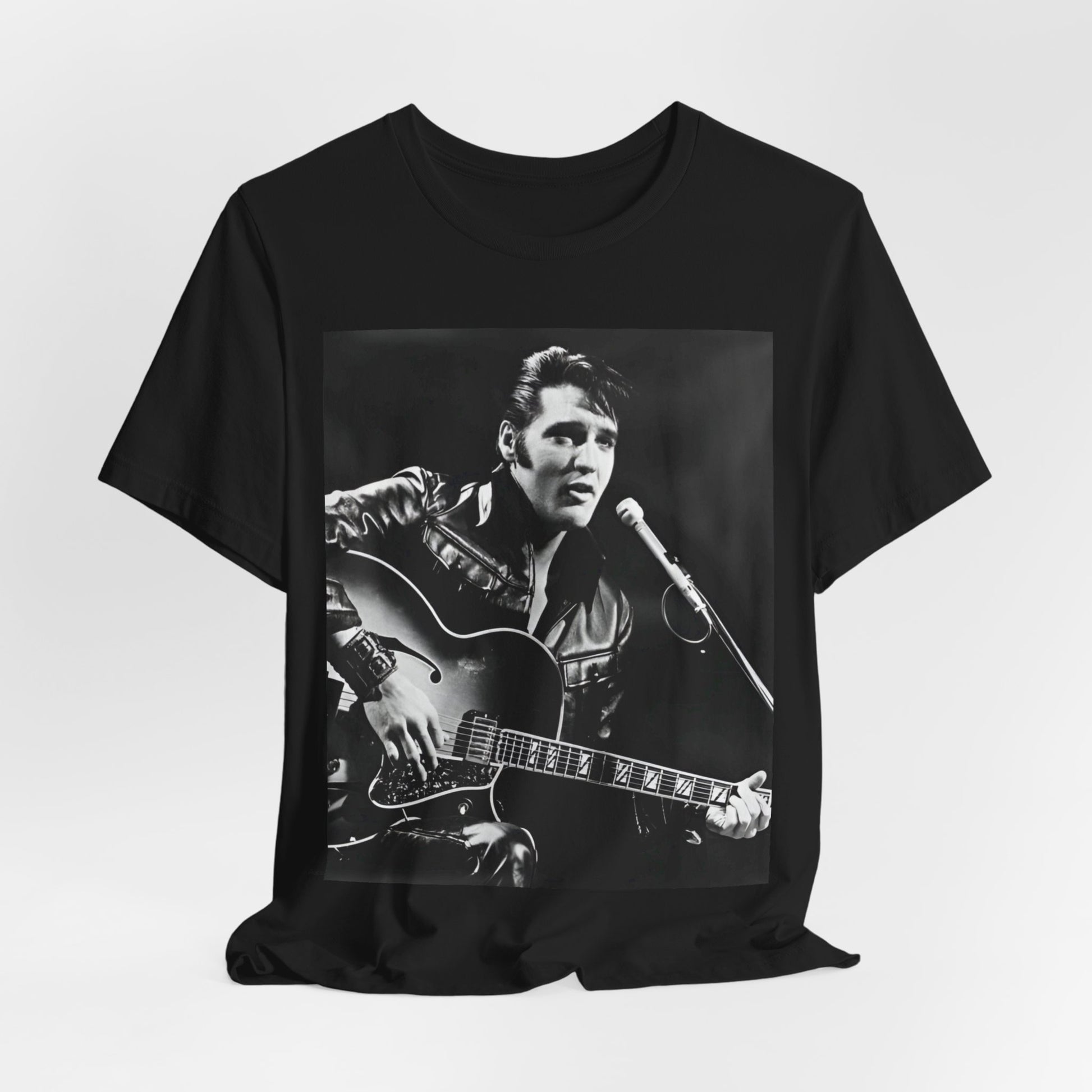 A black graphic t-shirt featuring a graphic related to Elvis Presley's 'Burning Love' song or era.